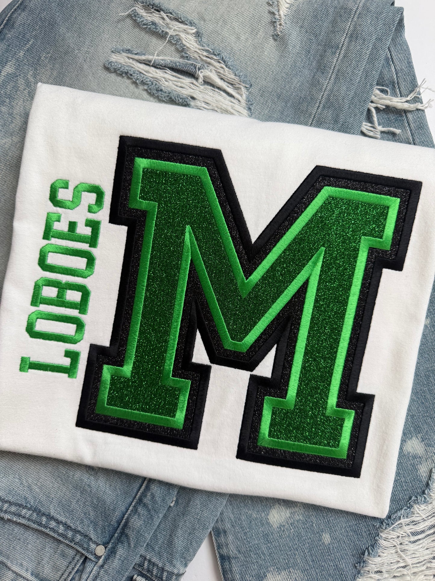 LOBOES Varsity M on white